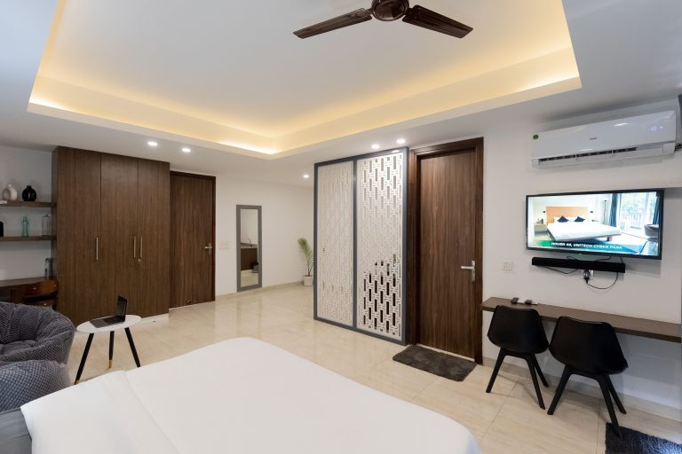 A well furnished accommodation room featuring space to sleep, work and relax
