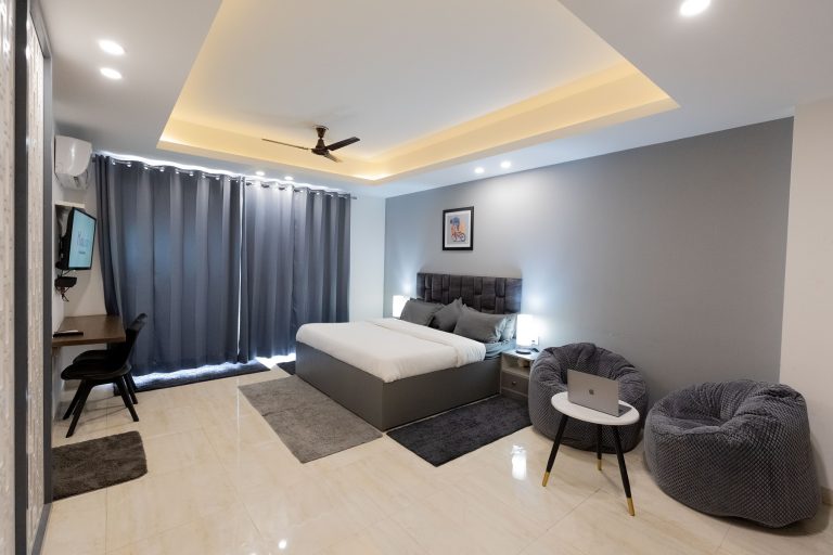 A well furnished accommodation room featuring space to sleep, work and relax
