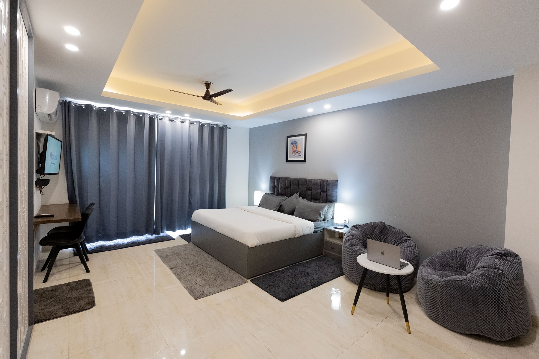 A well furnished accommodation room featuring space to sleep, work and relax