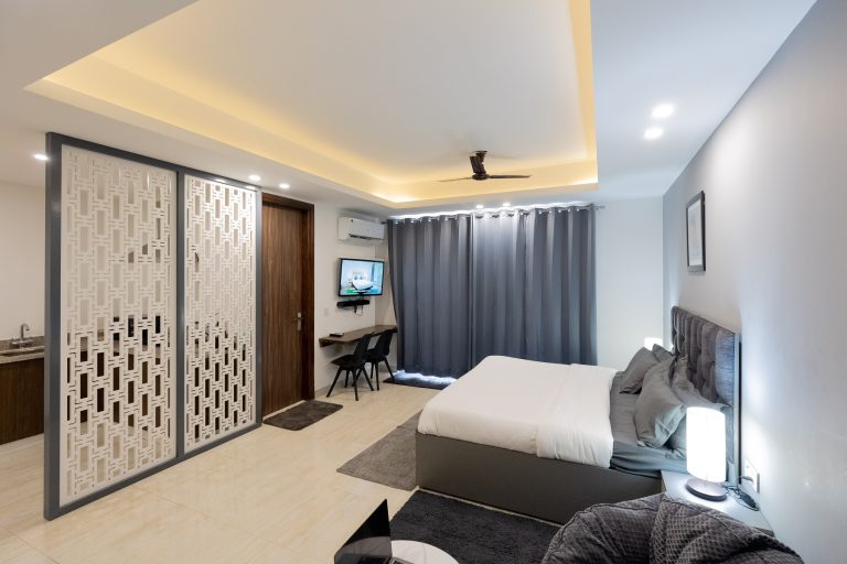 A well furnished accommodation room featuring space to sleep and work