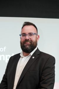 A headshot of David Winstanley