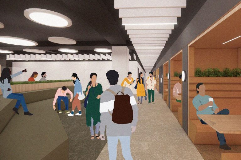 A large informal collaboration and seating space with smaller working pods to one side