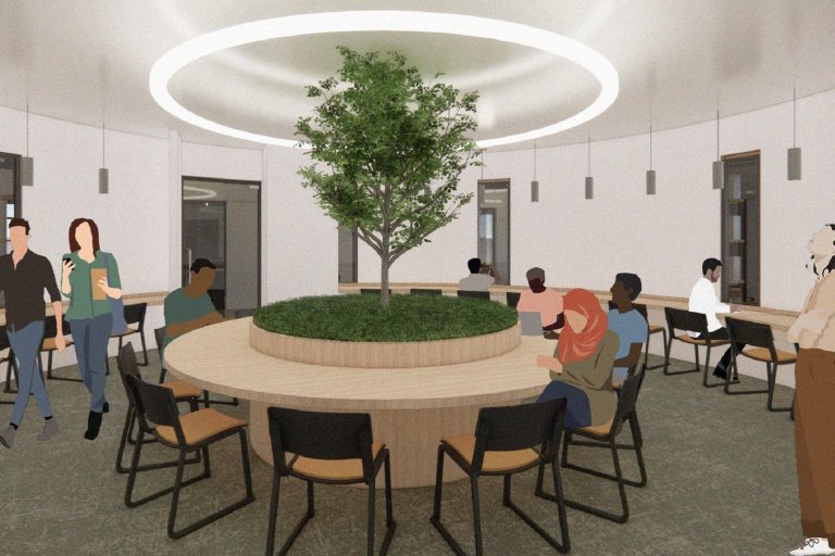 A circular reading room with an indoor specimen tree as the central focal point
